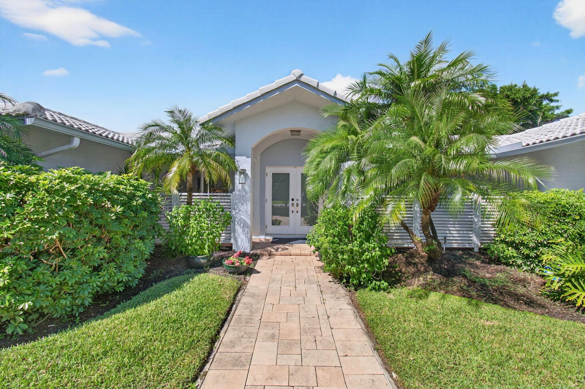Discover the magic of waterfront living with your own private dock on the Lake Ida canal. This beautifully remodeled home sits on nearly half an acre and features hurricane impact windows throughout, a bright open-concept floor plan, and elegant designer finishes. Enjoy a resort-style backyard perfect for entertaining, complete with a sparkling pool, covered patio, screened lanai, and private dock with lift providing direct access to Lake Ida. Just minutes to the beach and vibrant Downtown Delray, this home offers the perfect balance of luxury, lifestyle, and location.