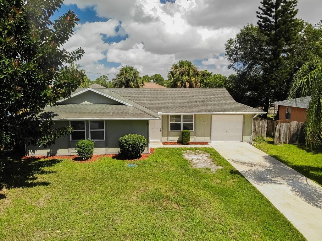 Photo of 1457 SW Flounder Lane, Port Saint Lucie, FL 34953 (MLS # R10921800)