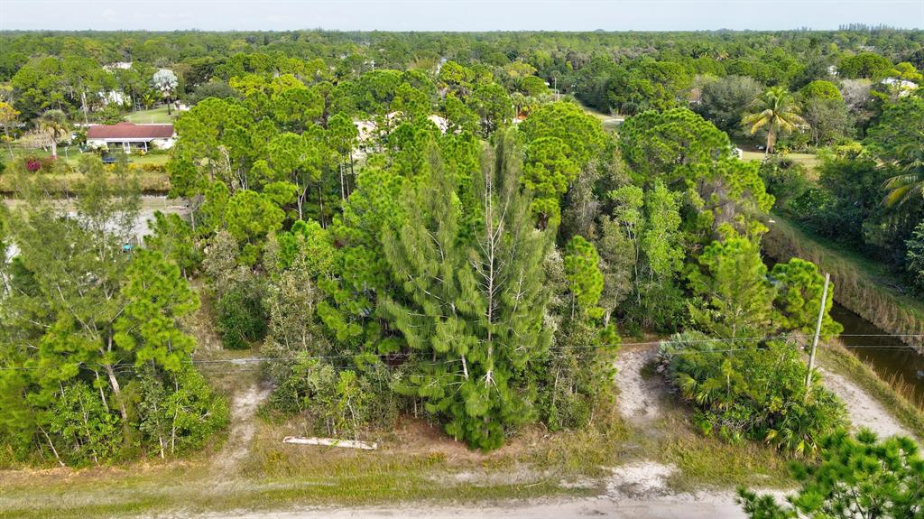 Vacant residential lot in Loxahatchee. 1.48 acres zoned for residential and agricultural - the perfect spot to build! Near the intersection of Hall & Orange in Loxahatchee, close to Publix, shopping & dinning