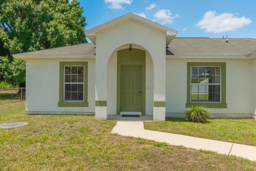 Photo of 545 SW Buswell Avenue, Port Saint Lucie, FL 34983 (MLS # R11093515)
