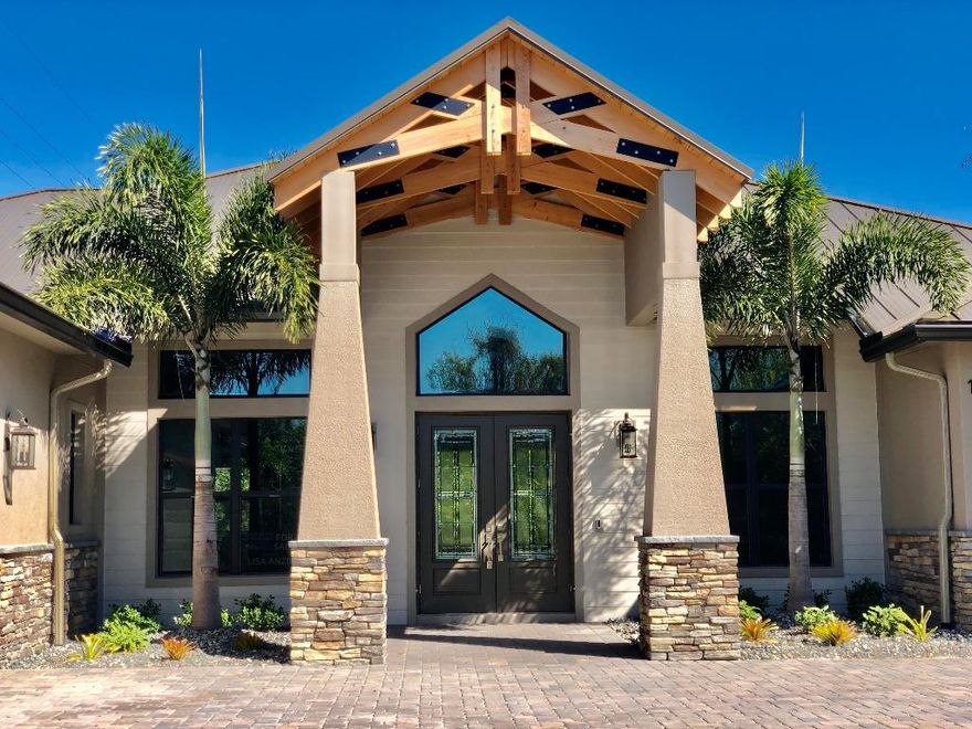 Brand new at BUILDERS COST!! DON'T MISS THIS...3 BEDS PLUS DEN ...All IMPACT doors and windows CBS, Concrete stucco and stone exterior METAL ROOF with secondary membrane for added durability. LAKEFRONT Custom built ''one of a kind'' home EASY QUICK CLOSE. Top quality finishes Cypress hand framed entry roof, foyer, kitchen and porch ceilings, wood look tile throughout, custom lighted cabinets, signature plumbing fixtures and granite throughout. Smart home featuring NEST temp control RING doorbell and digital front door entry.  ALL bedrooms have private baths & walk in closets,  upgraded Kitchen features Kitchenaid appliances and beverage center. All built with the quality you have come to expect from award winning LUMAR BUILDERS, INC 1/2ac lot.