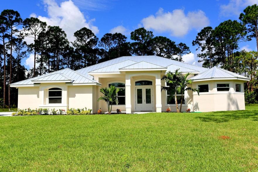 Brand NEW, 1 yr builder warranty! 3 bedroom/3 full bath/office/2cg.Total upgrades*impact windows, Icynene attic insulation, tankless water heater,granite, 10- 12'ceiling hts, sliding doors w/transoms above,oversize crown molding,wood plank tile,walk in double shower, frameless shower doors, full cabana bath onto covered back patio,pull down attic stairs all under energy efficient upgraded metal roof,hi quality filter system, Paved road! Walk to Citrus Grove Park.