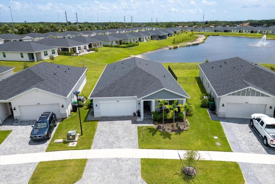 Beautifully designed 4-bedroom, 3-bath home featuring the sought-after Emilia floor plan by Meritage Homes in the gated Azalea community. Offering 2,190 sq. ft. of living space, this residence boasts a split floor plan, 2-car garage, and impact windows for peace of mind. Interior highlights include vinyl flooring and tile throughout, creating a modern and low-maintenance appeal. Enjoy serene lake views from the screened and covered lanai, perfect for outdoor living year-round.