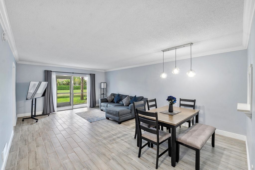 Photo of 8821 NW 38th Dr #103, Coral Springs, FL 33065 (MLS # B26000825)