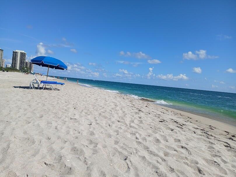 Beach lovers dream! Totally turn key 1 bedroom 1 bath ground floor apartment. Steps away from the beach.Fully furnished includes tile floors, full kitchen, washer and dryer, large bedroom with queen bed and flat screen TV, corner sofa includes pull out queen bed, flat screen 80'' TV in living area. independent AC control for living room and bedroom. Screened rear patio for relaxing and enjoying ocean breeze. Private beach is one of the best and widest in the area. Commercial mall within walking distance with restaurants, entertainment and stores.
