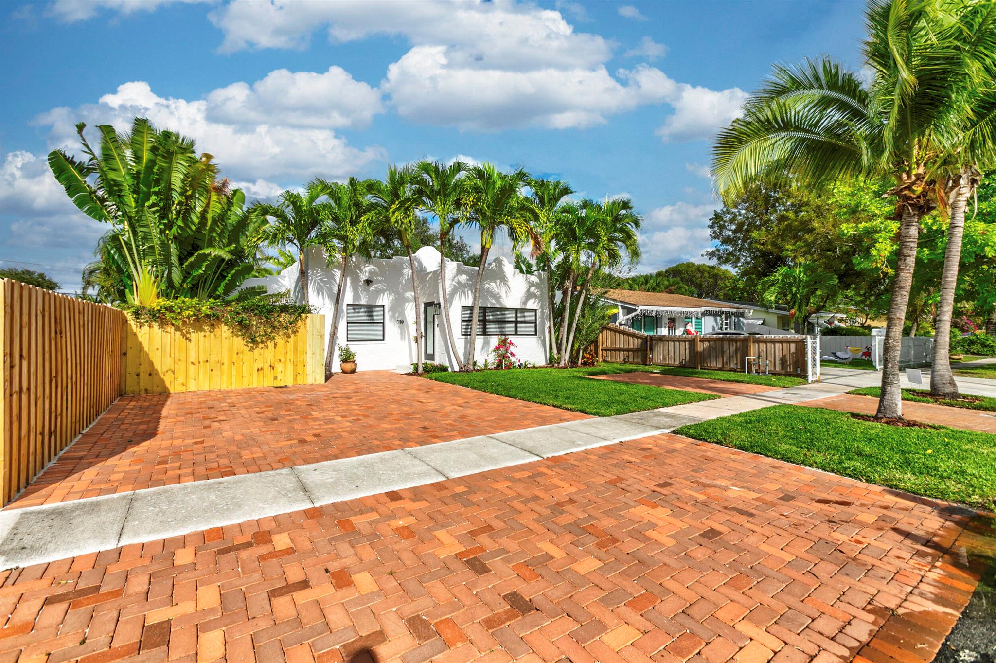 Charming Spanish style home in the center of West Palm Beach! This 3BR/2BTH opens up to a large entry foyer surrounded by large impact windows and features Mexican tile flooring. The entryway leads to the open & breezy living room and dining area with wood floors throughout. The kitchen features ample cabinet space with butcher board countertops, beamed ceilings, gas range, and Mexican tile floors. The primary suite has a recently renovated ensuite bath frameless shower and quartz vanity. The backyard boasts private fenced backyard with paver patio and lush landscaping. Close proximity to The Square (CityPlace), Antique Row, Palm Beach Island, Grandview Public Market, and Palm Beach International Airport.