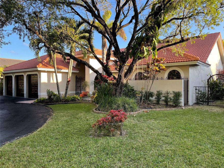 Renovated 5BR/3.5BA waterfront pool home on an oversized lot in the desirable Pine Ridge community of Coral Springs. True open concept living split floor plan with two ensuite bedrooms and three additional bedrooms in separate areas—ideal for guests or in-laws. Open kitchen features oversized quartz waterfall island, custom cabinetry, designer lighting, and stainless steel appliances, overlooking a great room with 15-ft ceilings and built-in wet bar. Hurricane-impact sliders open to covered outdoor kitchen, pool, and lush tropical backyard with premier waterfront views. Close to top-rated schools, parks, shopping, and dining. This house is the perfect mix of nature and city, and great for those who love to entertain. Welcome to a refined waterfront residence in the prestigious Pine Ridge community, where thoughtful design meets effortless indoor-outdoor living. This renovated 5-bedroom, 3.5-bath pool home is set on an oversized lot and features a highly desirable split floor plan with two private ensuite bedrooms and three additional bedrooms positioned for maximum privacy.The chef’s kitchen anchors the home with a dramatic quartz waterfall island, custom cabinetry, designer lighting, and premium stainless appliances, flowing seamlessly into a grand great room with soaring ceilings and a built-in wet bar. Walls of hurricane-impact glass open to a covered outdoor kitchen, resort-style pool, and lush tropical landscaping framing one of the community’s most scenic waterfront views. Enhanced by modern systems and meticulous care, this home delivers comfort, elegance, and exceptional entertaining appeal.