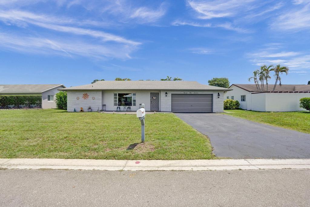 Great family home situated in the desirable Westwood Community neighborhood, featuring three bedrooms, two full bathrooms, low HOA fees, updated kitchen with granite counter tops, wood face cabinetry, SS appliances, ceramic tile floors throughout all living areas, laminate wood flooring in bedrooms, a family room, a 2-car garage, newer AC (2021), clubhouse, two community pools, and much more. This is an all-ages community.