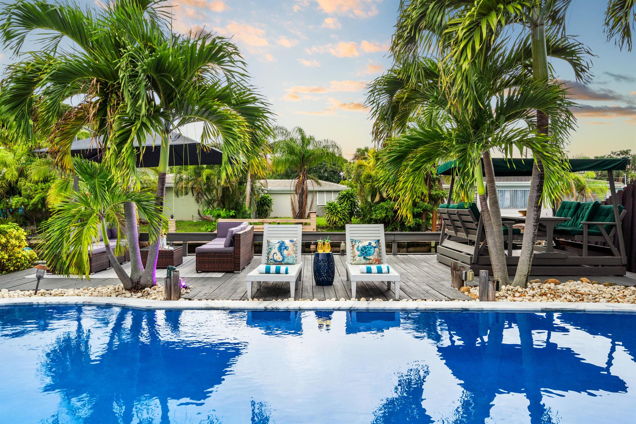 Welcome to your Island escape, a beautifully updated 4-bed/ 2-bath waterfront pool home designed for the ultimate South Florida lifestyle. Interior features include:Impact windows, porcelain tile flooring, and a gourmet chef's kitchen with custom cabinetry, premium stainless steel appliances, a center island, and wine cooler, & 2 fully remodeled bathrooms, Step outside to your private outdoor paradise, featuring a heated pool, fire pit, BBQ area, and plenty of space for entertaining. Enjoy kayaking or paddleboarding from your backyard canal, unwind in the game room, or simply watch the fish jump and manatees swim by.Located just minutes from beautiful Fort Lauderdale & Pompano Beaches.