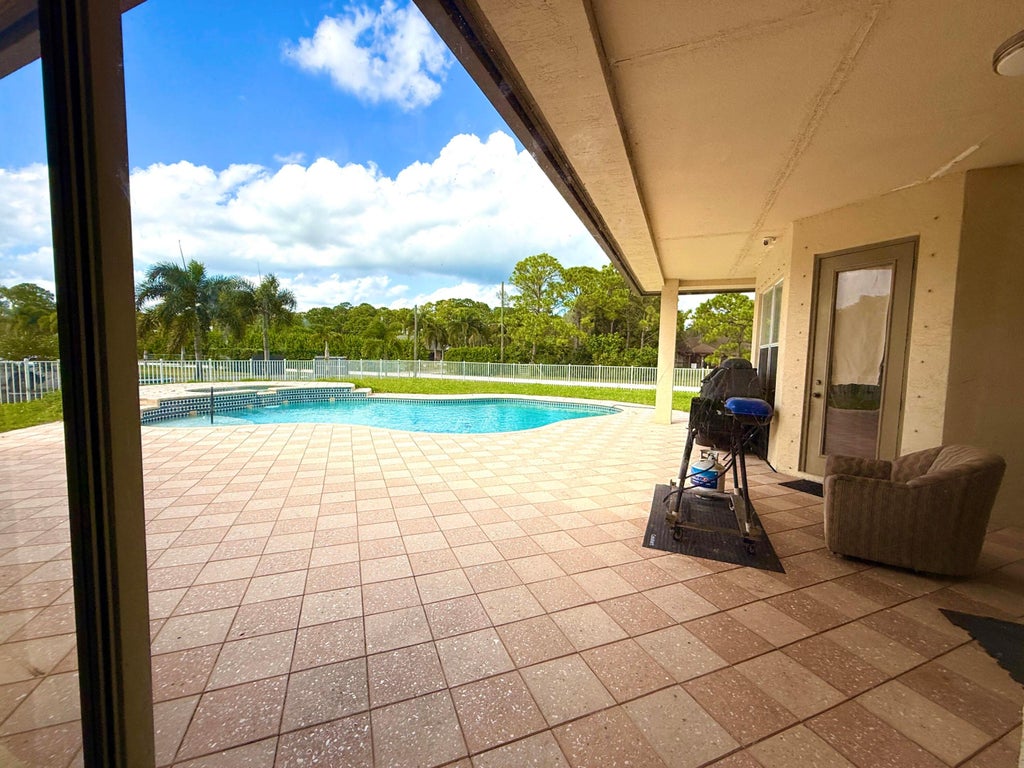 Photo of 6613 Hall Boulevard, The Acreage, FL 33470 (MLS # B26038134)