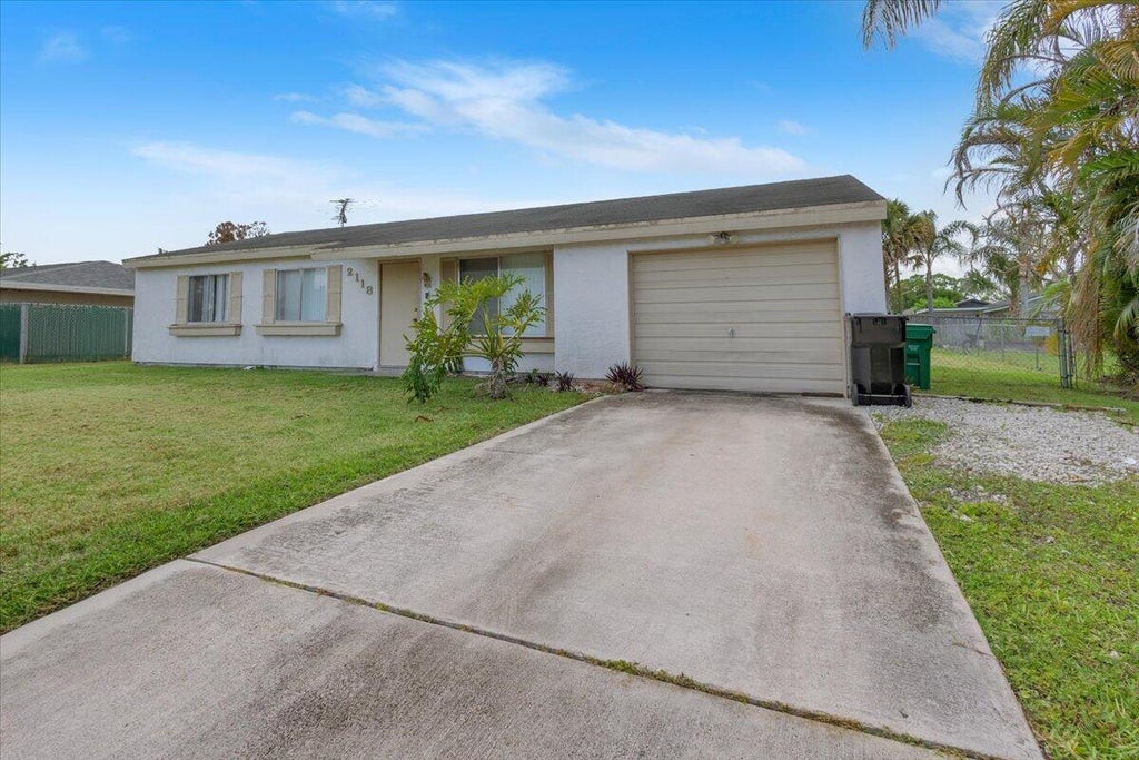 Photo of 2118 SW Airoso Boulevard, Port Saint Lucie, FL 34984 (MLS # B26052294)