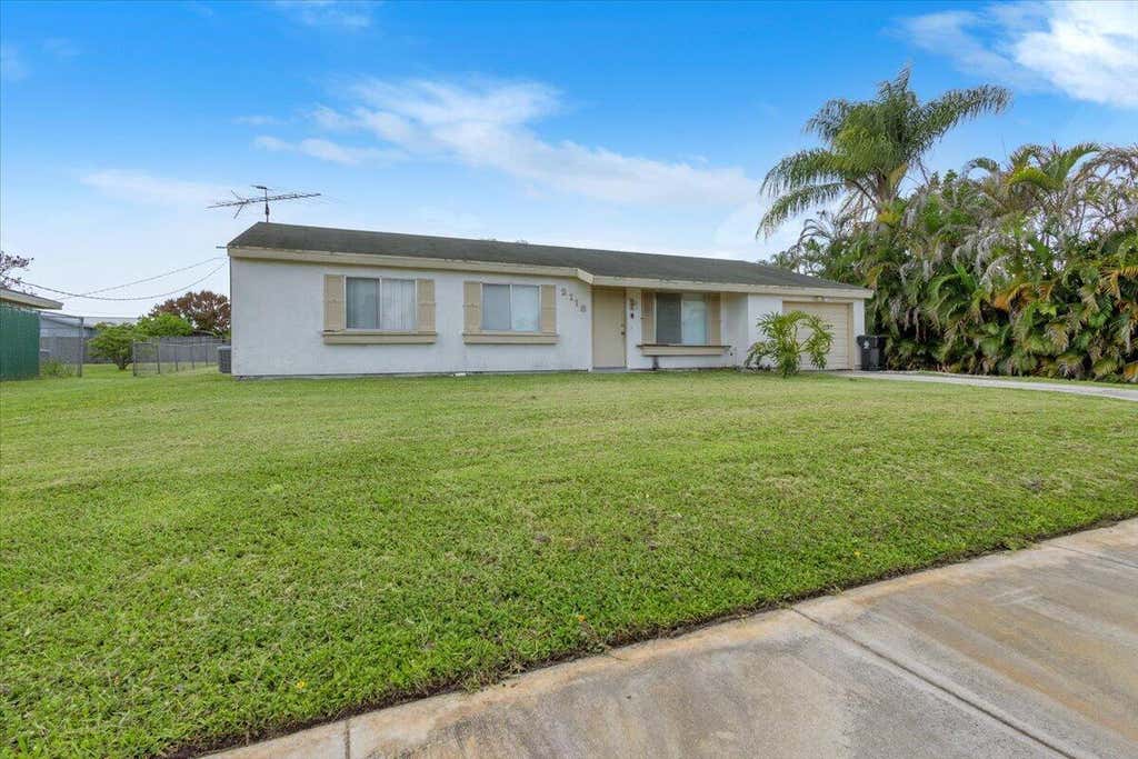 Photo of 2118 SW Airoso Boulevard, Port Saint Lucie, FL 34984 (MLS # B26052294)