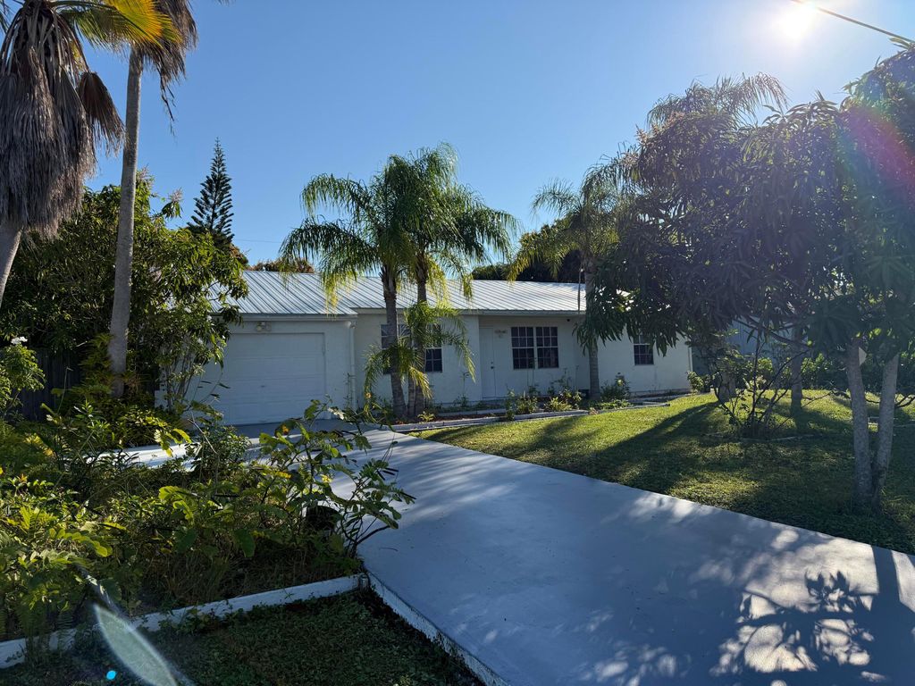 Photo of 2451 SE Berkshire Boulevard, Port Saint Lucie, FL 34952 (MLS # R11149772)