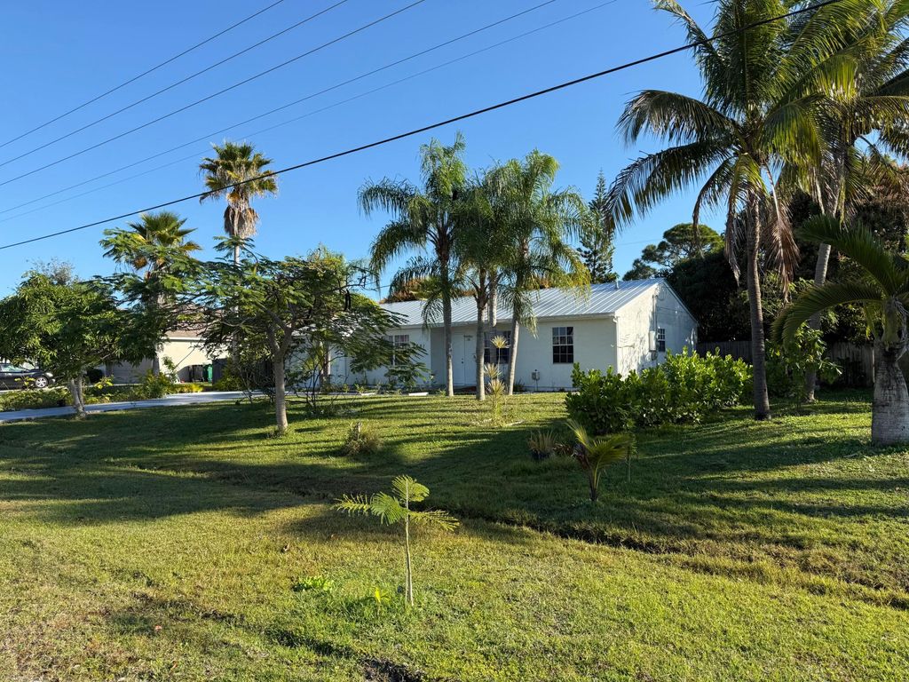 Photo of 2451 SE Berkshire Boulevard, Port Saint Lucie, FL 34952 (MLS # R11149772)