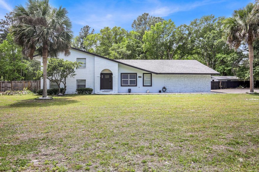 Beautifully remodeled home located just 30 miles west of Jacksonville International Airport, offering an impressive 8 bedrooms and 5 bathrooms. This spacious property has been thoughtfully updated throughout, featuring new plumbing, electrical, roofing, and impact-resistant windows for peace of mind. Inside, you'll find durable porcelain tile flooring, upgraded interior doors, and stylish new lighting. The fully renovated kitchen boasts modern cabinetry, sleek countertops, a tiled backsplash, and brand-new appliances. All bathrooms have been tastefully updated with tiled showers and contemporary finishes. Step outside to enjoy the in-ground pool, along with a large porch and patio—perfect for entertaining or relaxing. The home is equipped with two new 5-ton HVAC systems, ensuring comfort. Nestled in a charming, historic small town setting full of character, this unique property offers the perfect blend of modern upgrades and timeless appeal- Ready to welcome you home.