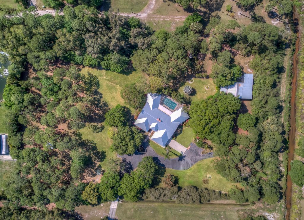 Photo of 8850 Hidden Pines Road, Fort Pierce, FL 34945 (MLS # R10964759)