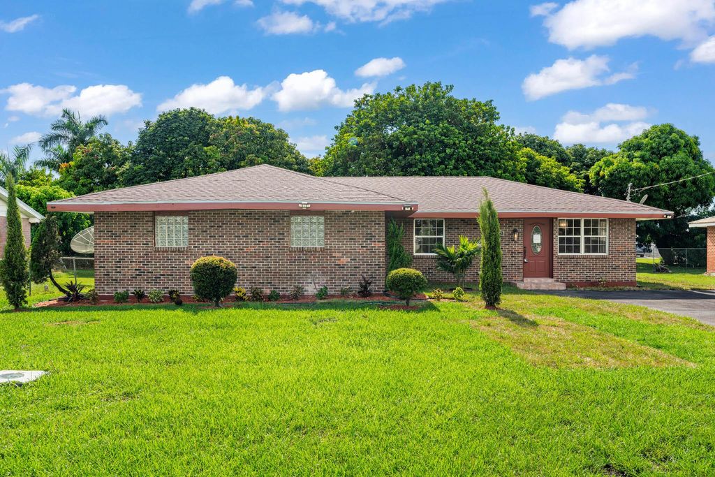 Photo of 200 NW 10th Street, Belle Glade, FL 33430 (MLS # R11117232)