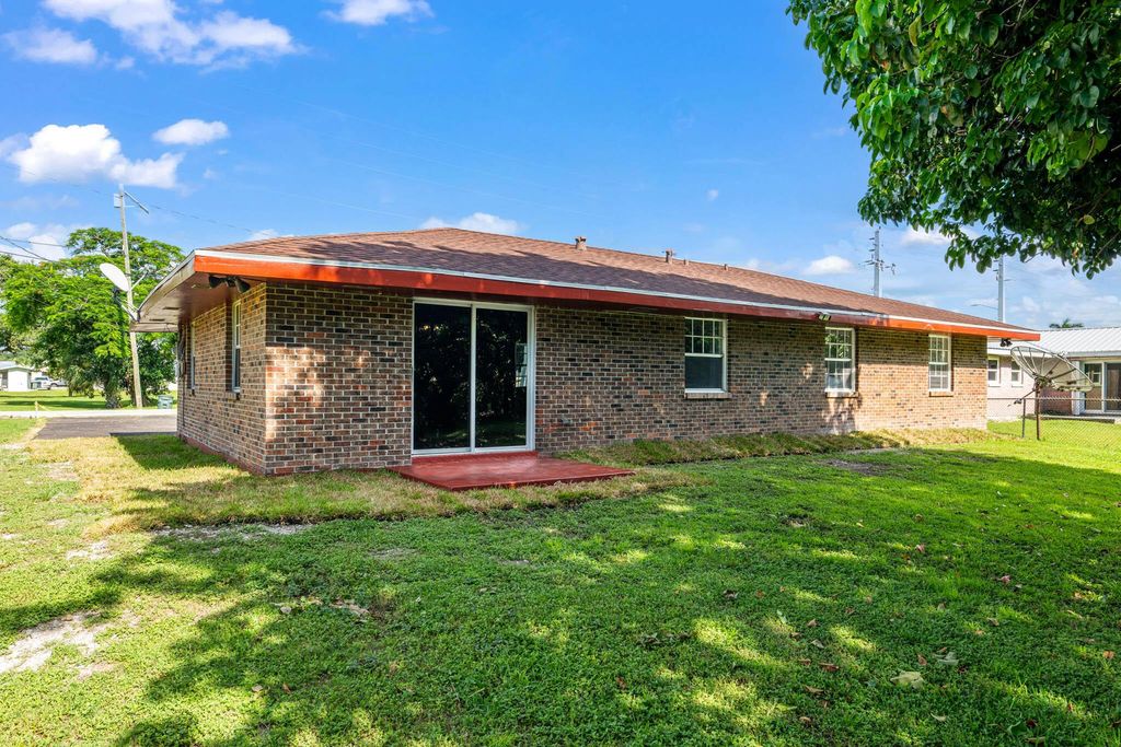 Photo of 200 NW 10th Street, Belle Glade, FL 33430 (MLS # R11117232)