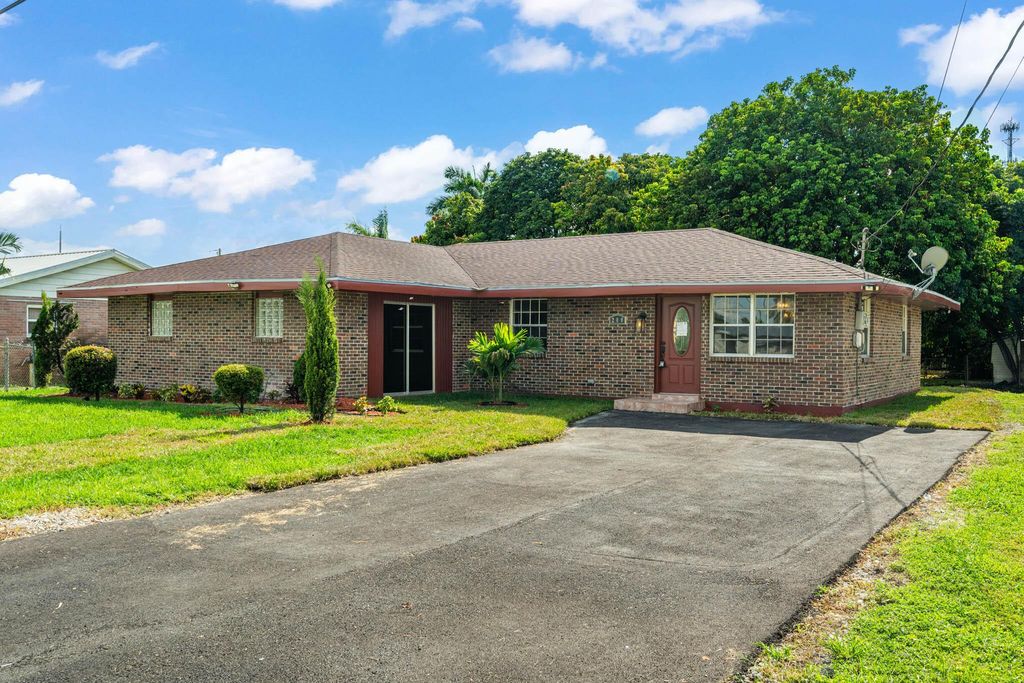 Photo of 200 NW 10th Street, Belle Glade, FL 33430 (MLS # R11117232)