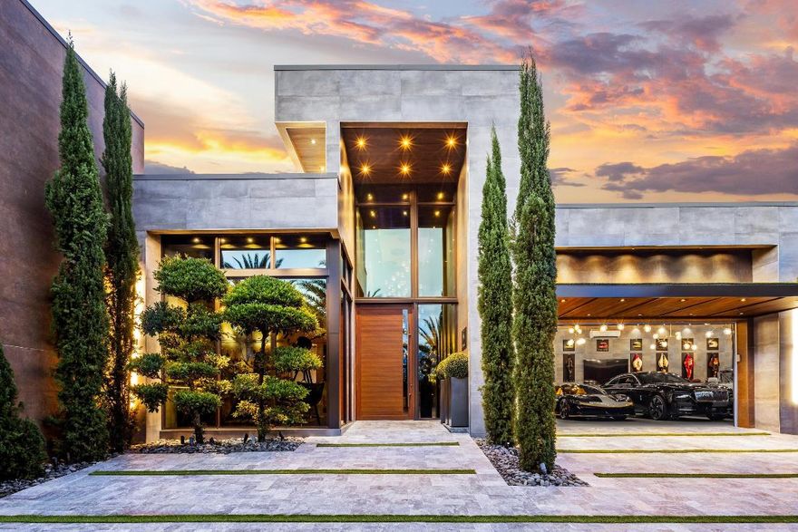 Welcome to Casa MiaBella, an architectural masterpiece meticulously conceived, designed, and realized by celebrity developer Aldo Stark of Prestige Design Homes. Renowned for his precision, artistry, and unwavering commitment to excellence, Stark has created a residence that is both a personal statement and a defining example of contemporary South Florida luxury. Set within the distinguished Coral Ridge Subdivision, this single-story estate offers unmatched privacy and security, surrounded by impeccably maintained homes, tree-lined streets, and providing effortless access to Fort Lauderdale's pristine beaches, premier golf courses, and refined dining, cultural, and leisure destinations. Spanning 9,253 square feet of refined space on a 21,036-square-foot lot, Casa MiaBella is a masterful expression of contemporary sophistication, defined by clean linear forms, striking architectural composition, and a seamless flow between indoor and outdoor environments. The thoughtfully conceived layout encompasses six impeccably appointed bedrooms, five luxurious bathrooms, and two powder rooms, all finished with bespoke materials and exquisite custom detailing. Designed with modern luxury in mind, the residence's floor plan seamlessly incorporates a private executive office, a fully equipped fitness studio, and a dedicated home theater, each intentionally integrated into the home to support an elevated lifestyle where functionality and elegance coexist in perfect harmony.

Upon entry, attention is immediately drawn to the grand salon, a striking centerpiece defined by floor-to-ceiling glass walls, soaring ceilings, and a luminous Brazilian onyx bar. The five-car gallery garage, fully enclosed in glass and accented with designer lighting, functions as both a practical amenity and a refined display, exemplifying Aldo Stark's commitment to design as an integral lifestyle element. Every detail, from the carefully curated color palettes to the thoughtfully designed ambient lightingenhances the sense of scale, sophistication, and contemporary elegance throughout the space.

The Grand Salon integrates naturally to the outdoors, where resort-style amenities define an exceptional standard of living. A fire-flanked pool and elevated spa are complemented by fountains, sculptural pergolas, and meticulously planted rows of Italian cypress and palms, creating a private and visually striking environment both day and night. One pergola is thoughtfully equipped with automatic retractable screens, a fully appointed summer kitchen, and a sit-down bar, providing the ideal setting for both intimate gatherings and grand alfresco entertaining.

The gourmet kitchen exemplifies Italian contemporary design, anchored by an oversized waterfall marble island, and enriched with luxurious walnut cabinetry. Sleek stone surfaces and precise architectural lines harmonize warmth with modern sophistication, creating a space perfectly suited for both elevated entertaining and everyday culinary pursuits. Adjacent, the dining room is distinguished by tiger wood and marble feature walls and a sculptural wine display, harmoniously combining artistry and functionality in a refined expression of luxury and taste.

The primary suite serves as a private sanctuary, offering direct access to the landscaped backyard and serene views of the pool and gardens. The spa-inspired bathroom is adorned in dramatic marble and features a freestanding soaking tub, glass-enclosed shower, dual vanities, and meticulously designed lighting. His-and-hers boutique-style walk-in closets, conceived as gallery dressing rooms, provide ample storage with custom cabinetry and integrated illumination, combining functionality with refined sophistication.

Situated within the distinguished Coral Ridge Subdivision, Casa MiaBella offers the rare combination of privacy and one of Fort Lauderdale's most coveted addresses. Residents enjoy effortless access to the Intracoastal Waterway, pristine beaches, and the renowned Coral Ridge Country Club, while the city itself presents a cosmopolitan array of fine dining, upscale boutiques, art galleries, and cultural attractions along Las Olas Boulevard and downtown Fort Lauderdale. Recognized as the Yachting Capital of the World, the region provides unrivaled boating and water sports opportunities, complemented by private marinas, scenic waterways, and year-round sunshine that epitomize South Florida coastal living. From world-class golf and tennis to refined nightlife and exclusive social clubs, this premier location perfectly complements Casa MiaBella's resort-style amenities, sophisticated entertaining spaces, and elevated luxury lifestyle.

Casa MiaBella transcends the notion of a residence, embodying Aldo Stark's design vision and standing as a definitive expression of contemporary luxury. It is a sanctuary where elegance, innovation, and meticulous craftsmanship converge, offering an unparalleled experience of refined living.