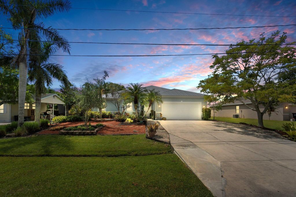 Photo of 1274 SW Emerald Avenue, Port St Lucie, FL 34953 (MLS # R10907597)