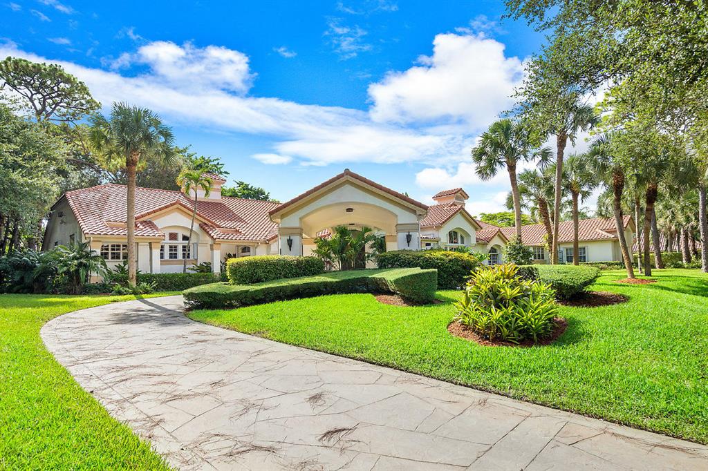 This sprawling 10,000 +/- Sq. Ft. One Story residence is sited on a lushly landscaped 1+/- acre lot in the prestigious luxury enclave, Foxe Chase, which is located just 3 miles from the Atlantic Ocean and is the eastern most community of all 1 Acre lots in South Palm Beach County. This elegant home, which features extremely large rooms throughout, was re-modeled in 2012, including all new electrical wiring, with 2/3 of the residence taken down to the studs and re-built, and 1/3 heavily re-done. The huge totally re-built island kitchen features white Downsview custom cabinets, Sub Zero refrigerator, freezer, double convection ovens, warming draw, beverage cooler and a large custom-built walk-in butler's pantry with custom cabinets and prep sink. The family friendly kitchen opens to the