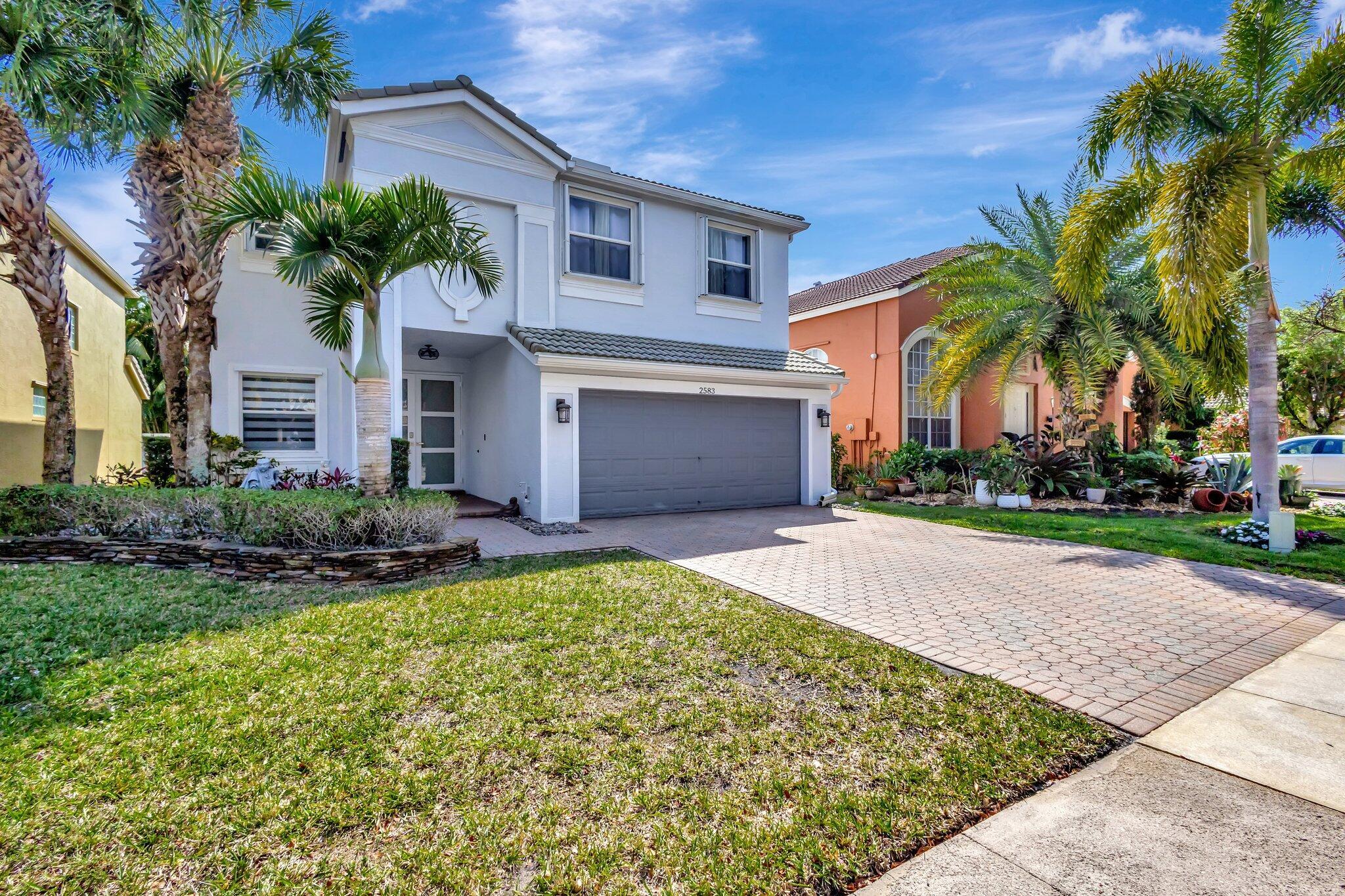 Live the lifestyle you've dreamed of in prestigious Olympia of Wellington! This stunning 5BR, 2.5BA home blends luxury, comfort & peace of mind with full renovation, hurricane impact windows/doors, soaring ceilings & premium whole-home water system w/ reverse osmosis. Sunlight fills the open layout, flowing to a private backyard oasis w/ custom pergola & romantic Italian lights--perfect for gatherings or quiet evenings. Walk your kids to top A-rated schools, enjoy world-class dining & shopping minutes away, and be at the beach or PBIA in under 20 minutes. Resort-style amenities, year-round events & a welcoming golf-cart friendly community make this more than a home--it's a place where every day feels like vacation! Low HOA--tour today!