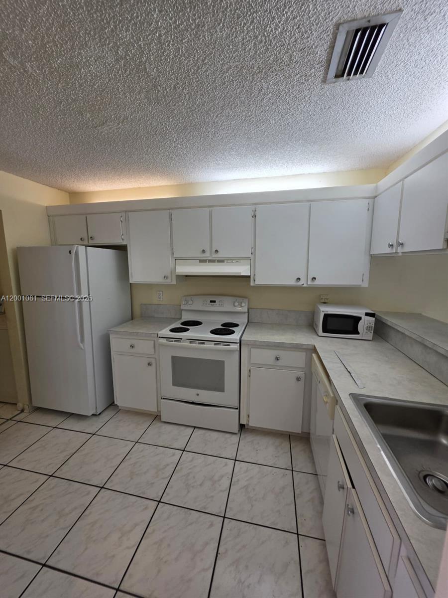 Photo of 7959 NW 41st Court #7959, Sunrise, FL 33351 (MLS # A12001081)
