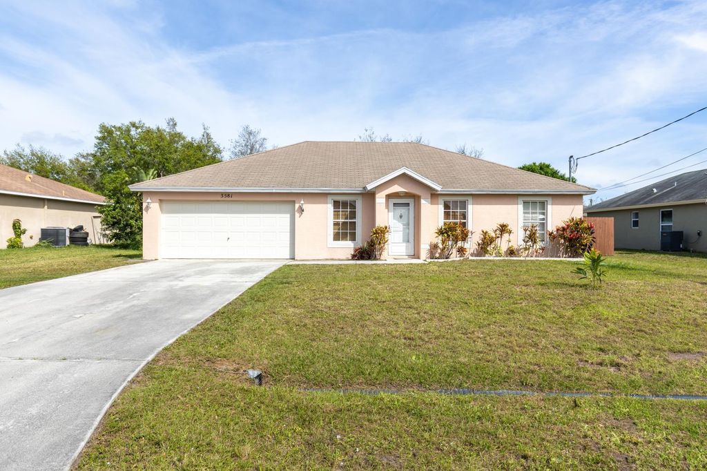Photo of 3581 SW Kromrey Street, Port Saint Lucie, FL 34953 (MLS # R11044782)
