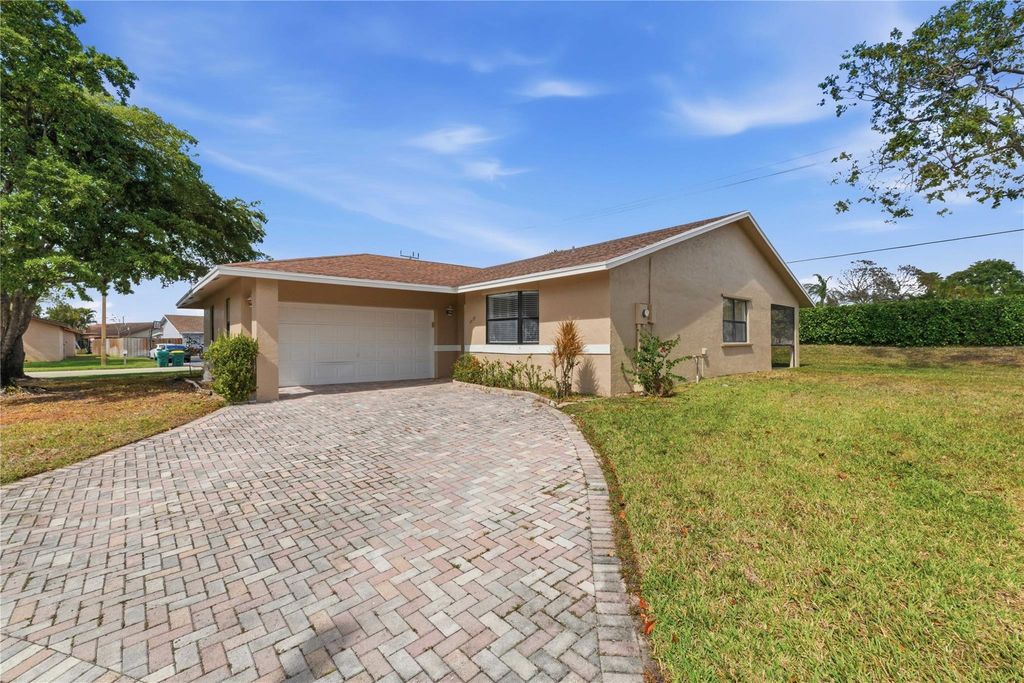 Photo of 7520 NW 88th Terrace, Tamarac, FL 33321 (MLS # F10556079)