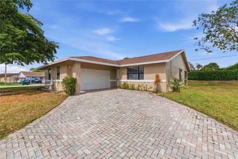Photo of 7520 NW 88th Terrace, Tamarac, FL 33321 (MLS # F10556079)