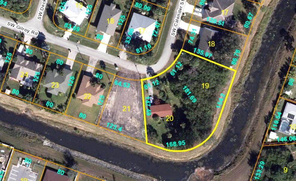High and dry oversized lot that backs up to beautiful canal. Located in residential area with very nice homes with no HOA. Minutes away from I95, turnpike and the Tradition area. Close to shopping and restaurants. (Owner split lots 19 & 20. Lot 19 is the lot for sale $99,900.)