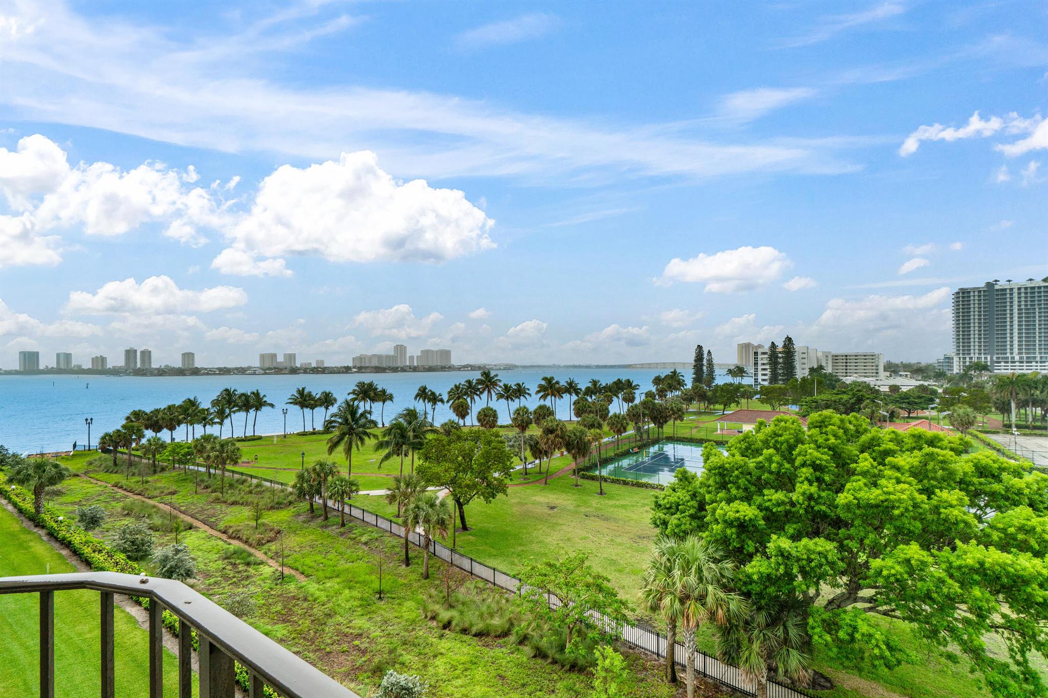 Wake up to sweeping views of the Intracoastal and Lake Worth Lagoon from this 2-bed, 2-bath, 1,440 sq ft waterfront condo. Enjoy serene mornings and stunning sunsets from your private balcony, with vistas reaching Singer Island's lush coastline. Whether relaxing or entertaining, this elegant retreat blends luxury living with the natural beauty of Florida's coastal paradise. Located next to Kelsey Park with tennis, pickleball, and open green space, and just minutes from shopping, world-class dining, PBI airport, and more. Amenities include two pools, BBQ area, outdoor billiards, a fishing station, and gated entry.