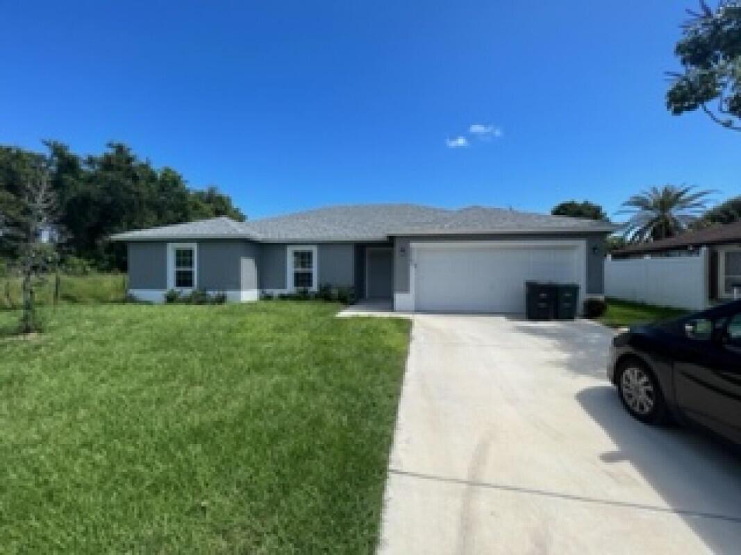 A beautiful new 4 bedroom, 2 bath, 2,248 total area sq. ft (1,809 under air), 2 car garage, and a large backyard, in a great location in Port St. Lucie.
