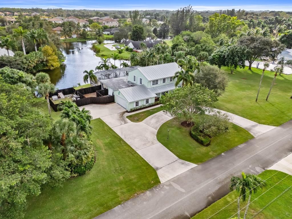 Photo of 864 Whippoorwill Row, West Palm Beach, FL 33411 (MLS # R11112390)