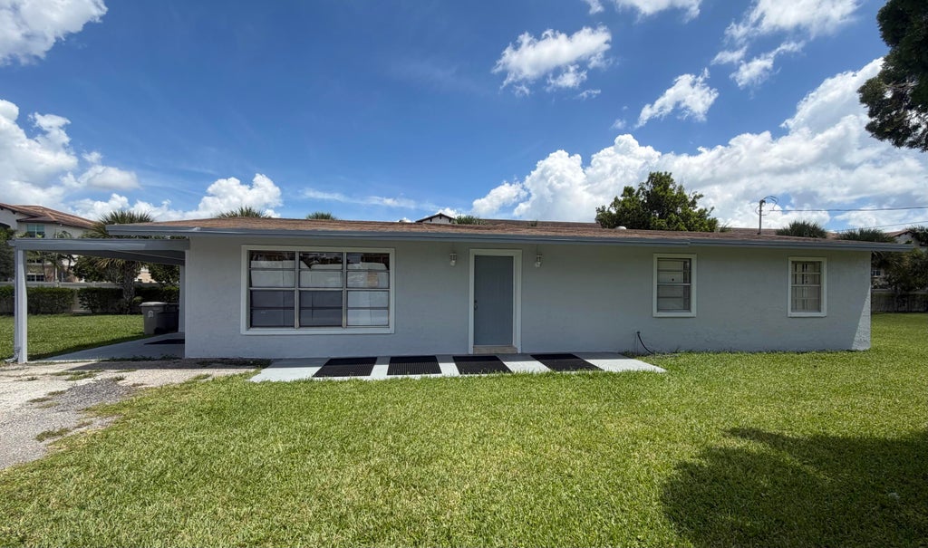 Photo of 2425 Ceceile Avenue, West Palm Beach, FL 33417 (MLS # B26059497)