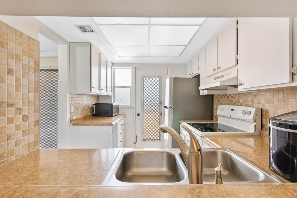 Photo of 1101 Crystal Lake Drive #309, Deerfield Beach, FL 33064 (MLS # B26009947)