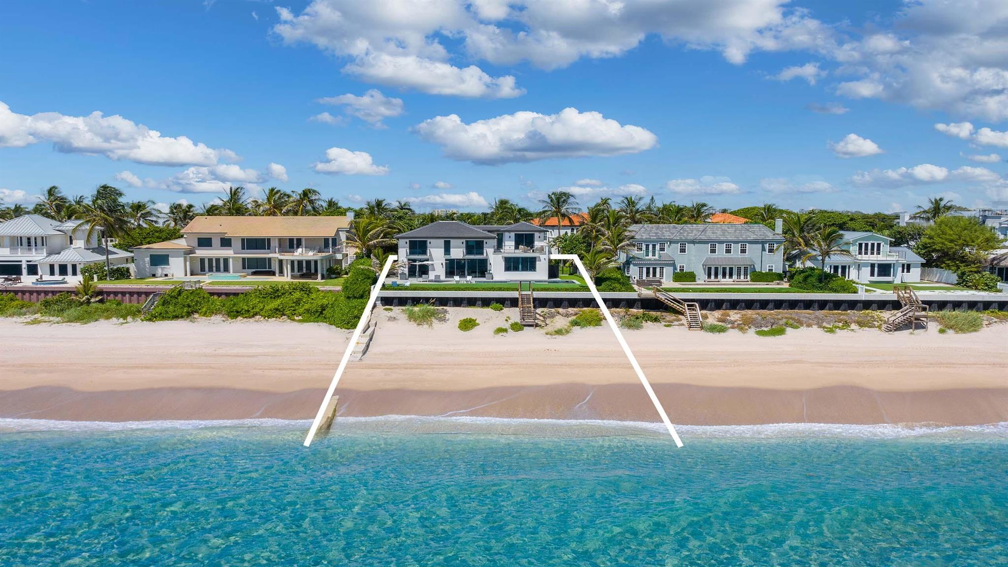 Offered furnished, this direct Oceanfront estate was completely rebuilt in 2019. Designed by Randall Stofft Architects and built to the highest of standards, this contemporary residence is move-in ready. The residence sits high above the ocean boasting wide water views with new seawall. Full of natural light, the home offers a clean, contemporary feel throughout. Features include ground floor primary suite overlooking the ocean; custom top-of-the-line seaside kitchen; elegant bar; three en suite guest bedrooms plus office; guest house; and two garage bays. Manicured and private grounds offer a stunning pool with spa overlooking the ocean with path to beach. Enjoy the short distance to Delray Beach and Palm Beach for exceptional dining and shopping. This is oceanfront living at its best.