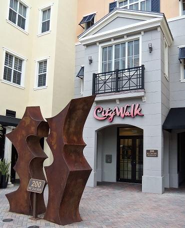 Fabulous location, corner unit 4th floor. City Walk in Pineapple Grove gives you access to all Delray has to offer. Make this large, one bedroom, 1000+ sq ft apartment your home. The amenities are top of the line with washer and dryer in kitchen. Granite counters and stainless appliances complete the Gourmet kitchen with Breakfast bar. The large bathroom has separate shower and luxurious soaking tub. A large master bedroom overlooks the city's 100 ft Christmas tree. Enjoy the view from living room or your bed!Extra storage and assigned parking make this the ideal living in the city experience. Available immediately!