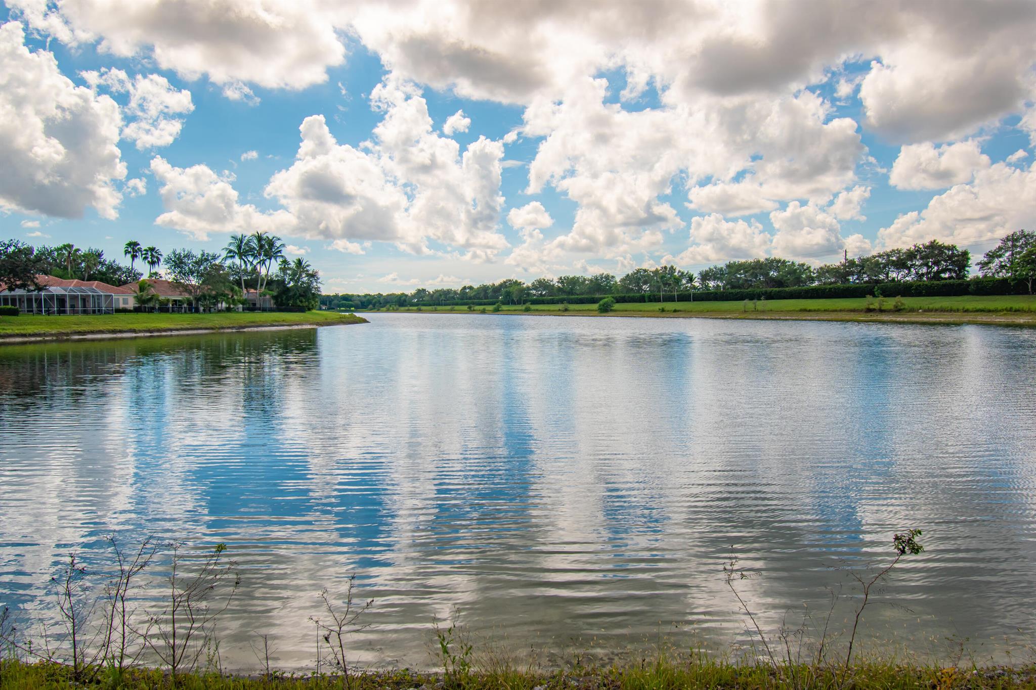 Long Lake View with Private Screened Patio DiVosta Signature Community * Whirlpool Appliances* Custom Window Treatments* Poured/reinforced concrete const, New Roof, *Washer/Dryer 2024 * A/C aprox 4 years old**Resort‑style living on 30 waterfront peninsulas--gated, amenity-rich, and connected by scenic bridges and 12 miles of walking paths