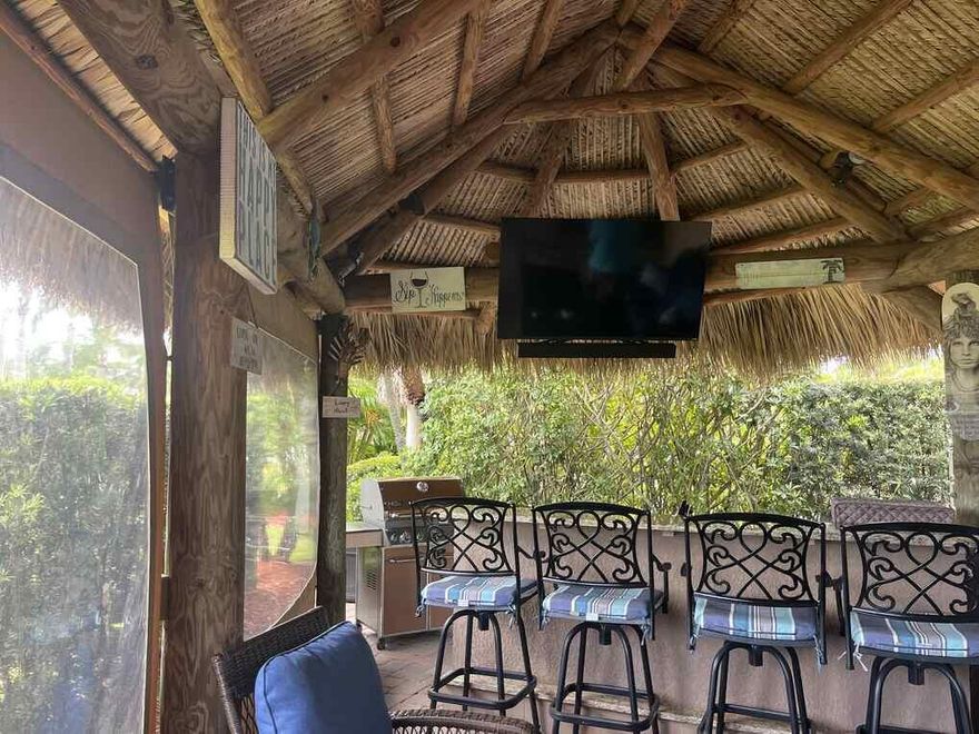 Beautiful 5 star resort in Motor Coach Resort . Enjoy this  wonderful lot that is on the golf course with beautiful sunsets. Granite top kitchen with bar area to enjoy outdoor entertainment.  Weber grill , stainless steel cabinets for storage ,stainless steel refrigerator with sink.Newly thatched large tiki. Very active resort. The resort has everything that you would want close to shopping , dining and beaches. Mature landscaping , private location. Electric remote controlled roller shades. Resort has 4 pools and hot tubs, pickle ball several courts, golf par 3 golf course, shuffleboard, bocce ball , darts, gym, yoga, water aerobics, tennis, clubhouse ,bike club.Happy hour Fridays 5-7.
Eisenglass curtains protecting from rain and wind