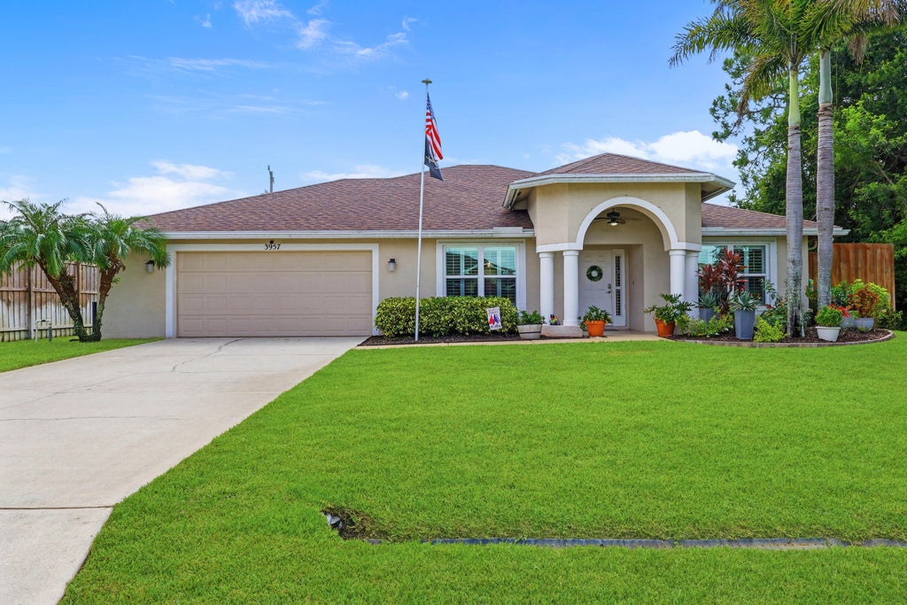 Photo of 3957 SW Helmlinger Street, Port Saint Lucie, FL 34953 (MLS # B26060495)