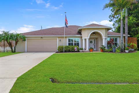 Photo of 3957 SW Helmlinger Street, Port Saint Lucie, FL 34953 (MLS # B26060495)