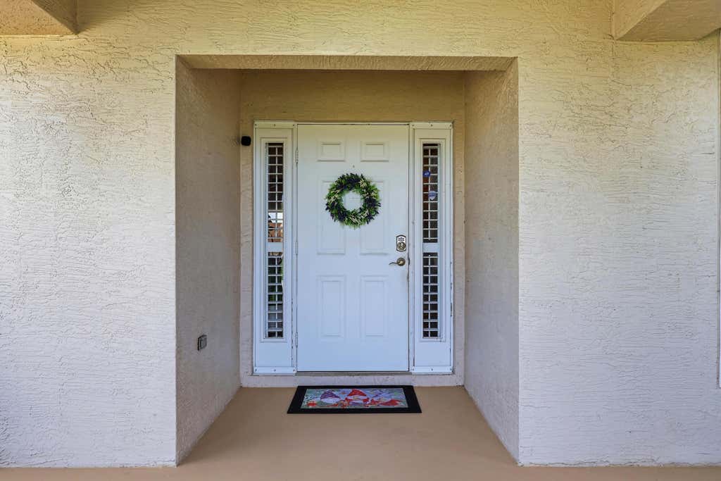 Photo of 3957 SW Helmlinger Street, Port Saint Lucie, FL 34953 (MLS # B26060495)