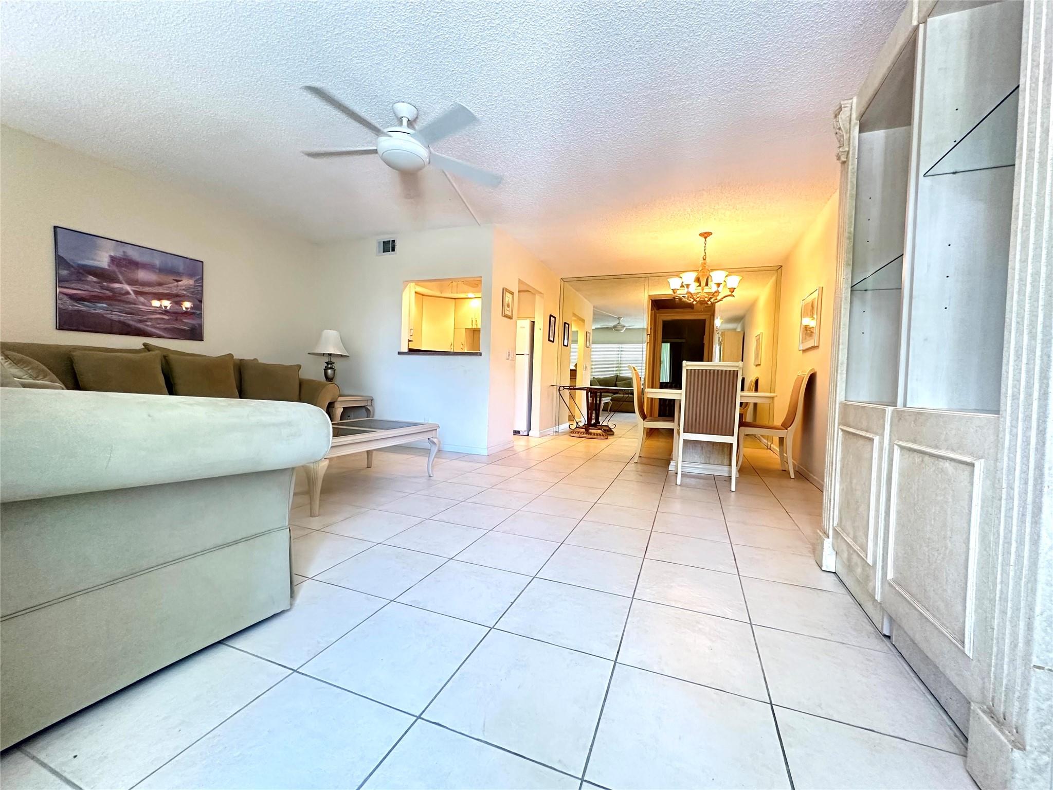 PRIME LOCATION! Walk to plaza, pool & CLUBHOUSE! This immaculate 1 bedrm, 1.5 bath is furnished & nicely updated with a KOSHER kitchen featuring extra counter space, white appl & recessed ltg. Beautifully remodeled primary bathrm w/lg vanity, glass shower doors & tiled walls. Tile flrs in liv areas, carpet in bedrm. Ceiling fans in every room. Relax w/ a cup of coffee in the lg. encl patio w/roll down shutters & a tranquil garden & pool view. Bldg has a shabbat elevator & full reserves. Come enjoy resort style amenities in this gated comm w/24 hr sec, free busses, pools, tennis, pickleball, putting green, Cafe & State-of-the-Art Clubhouse featuring classes, clubs, billiards, gym, theater, movies & much more! Close to shopping, dining & beach! YOU WILL LOVE LIVING HERE! Assoc. Claims 55+.