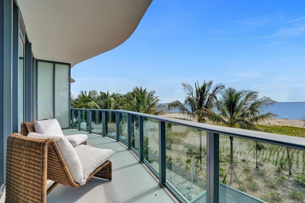 Experience the ultimate in Oceanfront living at Casamar: Pompano's newest luxury property! This totally unique oversized 1 bed plus den floorplan boasts soaring 11' ceilings & floor to ceiling glass overlooking 283 feet of white sand beach, dunes & the ocean. 1,350 sf of living area flows seamlessly into the 256 sf oversized glass balcony. Top of the line finishes include Italian cabinetry, Sub-Zero & Wolf appliances, gas range, an integrated espresso/cappuccino system, floating bathroom vanities, soaking tub, contemporary tile flooring, custom lighting fixtures & motorized Lutron blinds. Sold designer furnished! Unparalleled resort-style amenities include sunrise & sunset pools, state of the art fitness center, saunas, concierge, valet, lounges, golf simulator & pickleball court.
