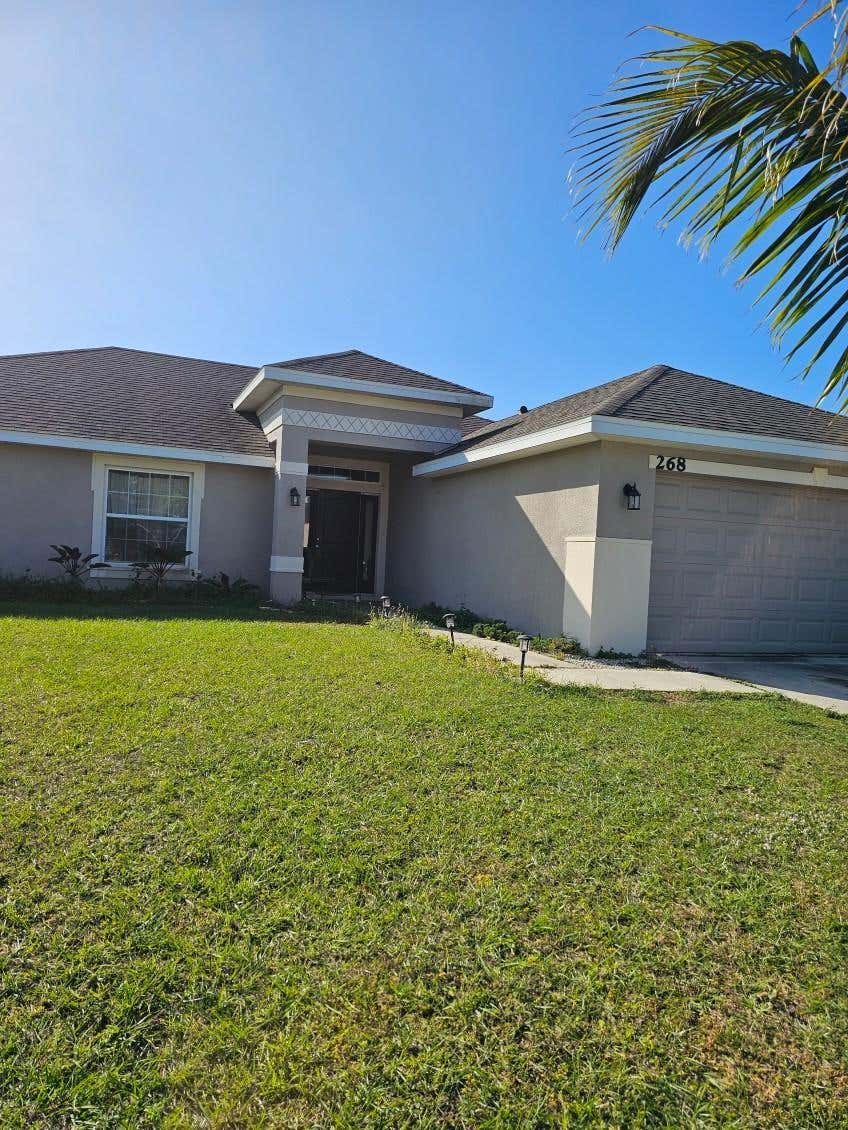Photo of 268 SW Grove Avenue, Port Saint Lucie, FL 34983 (MLS # F10475845)
