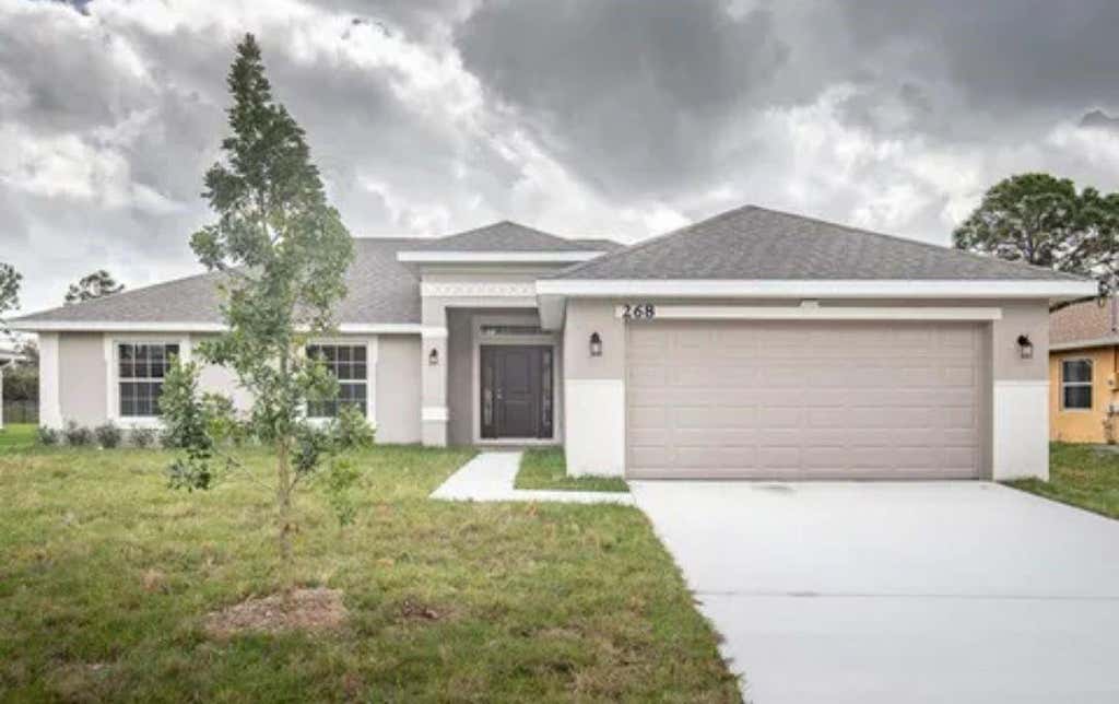 Photo of 268 SW Grove Avenue, Port Saint Lucie, FL 34983 (MLS # F10475845)