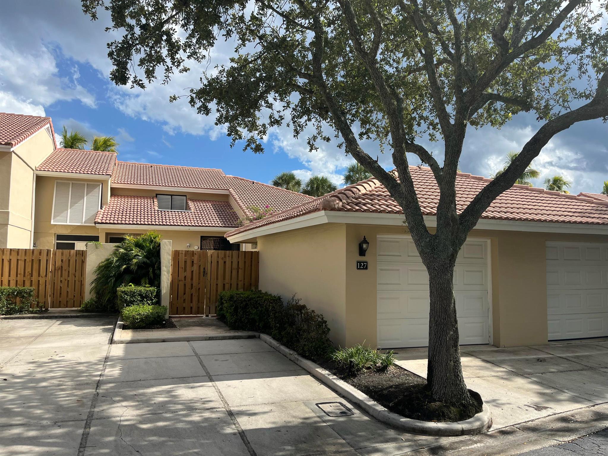 Nice unit, light and bright, with a bedroom and bath on first floor. Main bedroom up. Walk in closet.All updated and furnished ready to go for your seasonal needs!Gorgeous community pool, peak of a fountain, sliders open to a screened patio. Grill, private patio, one car garage. Stupendous location adjacent to the resort. Gated community, on PGA Boulevard, within PGA National.