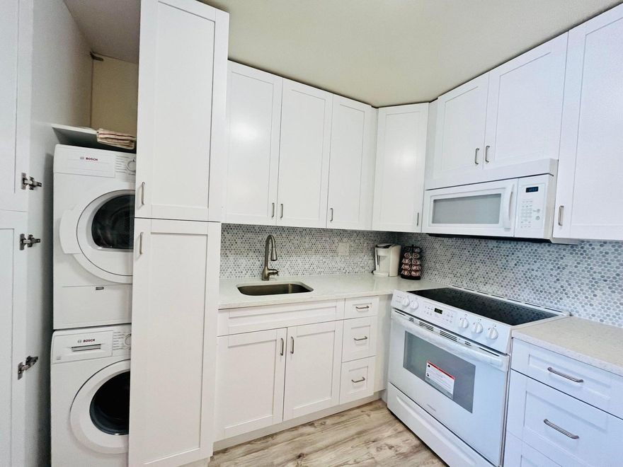 WOW! STUNNING ! LIGHT & BRIGHT IMMACULATE NEWLY RENOVATED EXTRA LARGE UNFURNISHED 1 BED 2 BATH 2ND FLOOR UNIT WITH NICE WATER-VIEW. THIS UNIT IS AS LARGE AS SOME OF THE TWO BEDROOM UNITS IN THE VILLAGE. MODERN UPDATED WHITE KITCHEN COMPLETE WITH QUARTZ COUNTER TOPS, LOTS OF CUPBOARD SPACE AND WASHER/DRYER.  LARGE MASTER BEDROOM WITH WALK IN CLOSET AND ENSUITE UPDATED BATHROOM. SPACIOUS LIVING ROOM, AND DINING ROOM.  CENTRAL AIR CONDITIONING. ENJOY THE BEAUTIFUL VIEW FROM THE LANAI. AMAZING LOCATION  SHORT WALK TO THE CLUBHOUSE AS WELL AS THE HASTINGS FITNESS CENTER.COME & ENJOY RESORT STYLE LIVING IN THIS GATED COMMUNITY FOR ACTIVE ADULTS 55 + CLUBHOUSE features a theater, indoor pool, card room, community/party room, billiard room ,shuffle board ,tennis , pickleball ,bocce and two Bocce and two outdoor pools. Numerous heated outdoor pools throughout the community.Separate fitness center with gym , outdoor heated pool and a resistance pool. Two guarded gates and 24 hour roving security patrol. GREAT LOCATION: close to shops, restaurants, PBI airport and beaches.